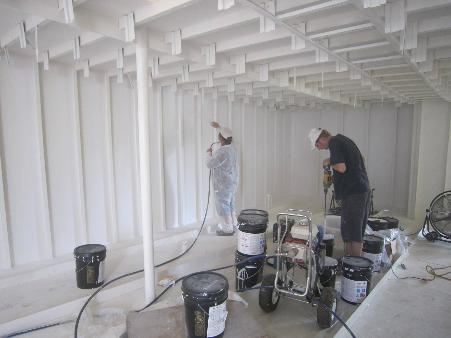 Applying thermaCote to the interior of a ship